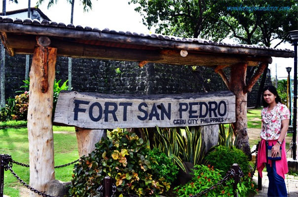 Juliet posing in Fort San Pedro's Logo