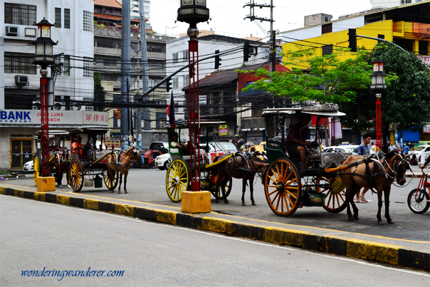 Plenty of horse carriages outside the Binondo Church