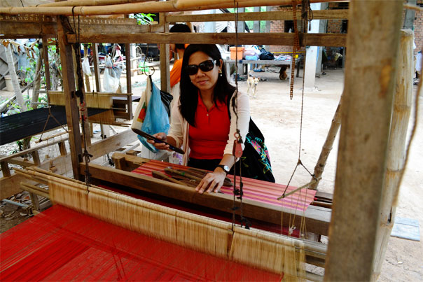 Tourist posing at the loom