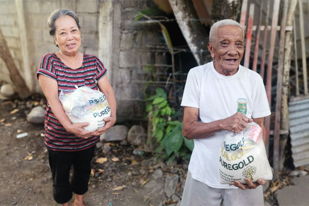 Joyful senior receiving the Covid-19 food packs