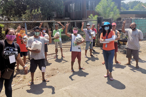 Group of tricycle and pedicab drivers practicing social distancing