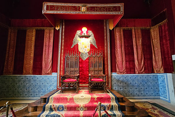 Red medieval throne room inside the Segovia Castle